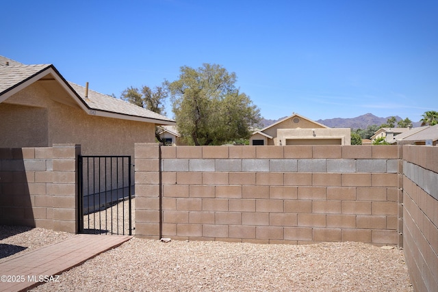 1542 N Amberbrooke Ave, Tucson, AZ 85745 - view of yard with a mountain view and a gate