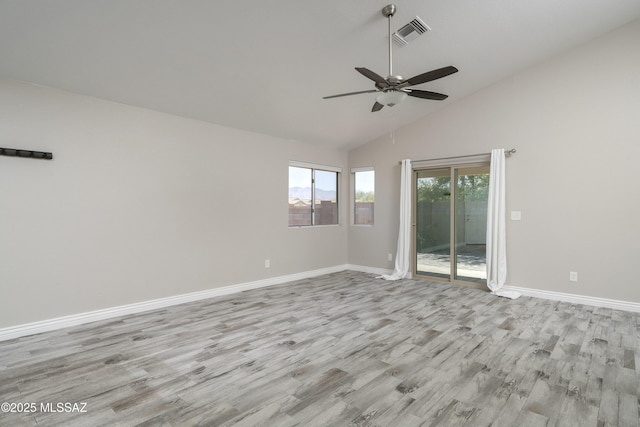 1542 N Amberbrooke Ave, Tucson, AZ 85745 - spare room with light wood-type flooring, ceiling fan, baseboards, and high vaulted ceiling