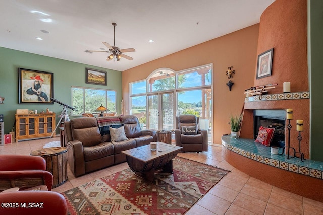 489 W Wedge Way, Green Valley, AZ 85614 - living room featuring tile patterned floors, a ceiling fan, plenty of natural light, recessed lighting, and a fireplace with raised hearth