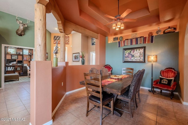489 W Wedge Way, Green Valley, AZ 85614 - tiled dining area with a raised ceiling, ornate columns, baseboards, and a ceiling fan