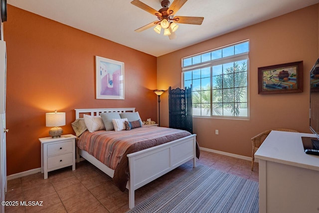 489 W Wedge Way, Green Valley, AZ 85614 - bedroom featuring baseboards, light tile patterned floors, and a ceiling fan