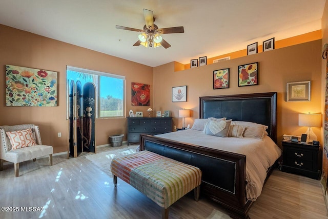 489 W Wedge Way, Green Valley, AZ 85614 - bedroom featuring wood finished floors, baseboards, and ceiling fan