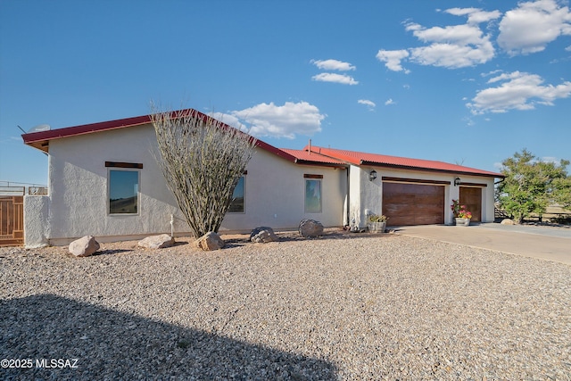 4 Mustang Trl, Sonoita, AZ 85637 - view of front of property with concrete driveway, an attached garage, and stucco siding