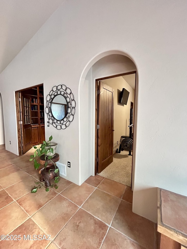 4 Mustang Trl, Sonoita, AZ 85637 - hall with arched walkways, tile patterned floors, and vaulted ceiling