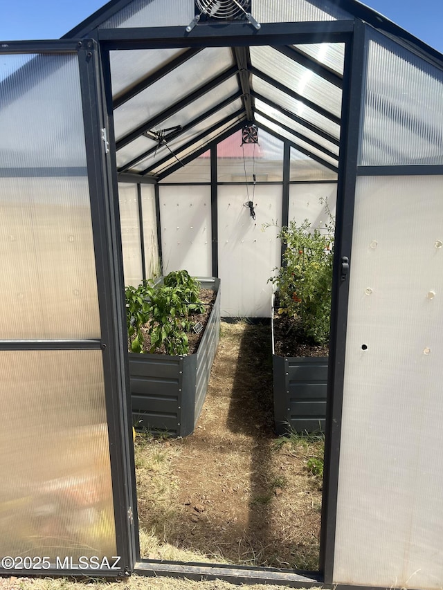 4 Mustang Trl, Sonoita, AZ 85637 - exterior view of a greenhouse and a vegetable garden
