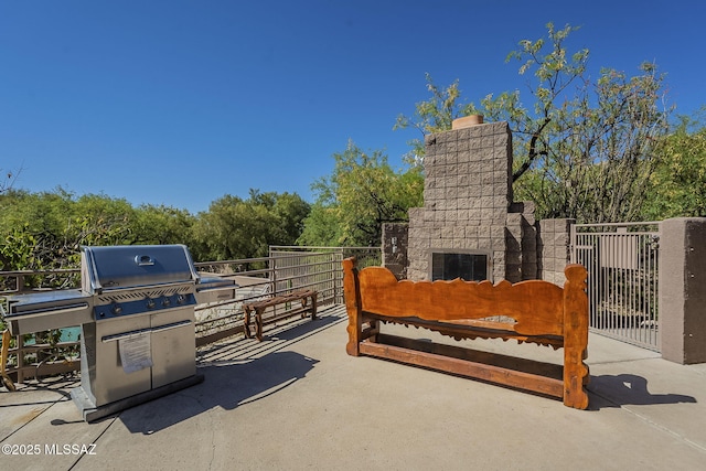 6655 N Canyon Crest Dr NE Unit 6130, Tucson, AZ 85750 - view of patio with an outdoor stone fireplace and area for grilling