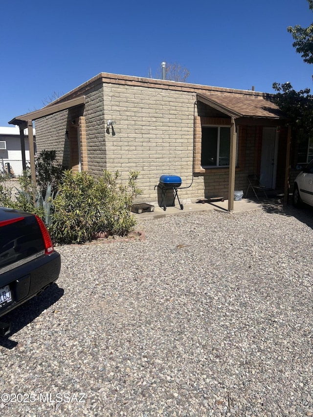 321-323 E Olive St, Tucson, AZ 85706 - view of property exterior featuring brick siding