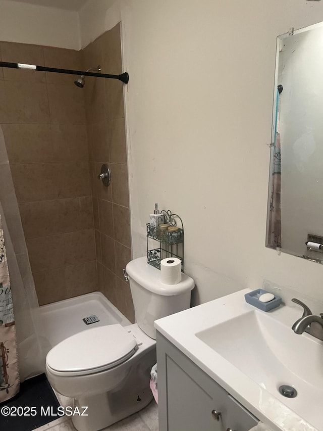 321-323 E Olive St, Tucson, AZ 85706 - bathroom with vanity, tiled shower, and toilet