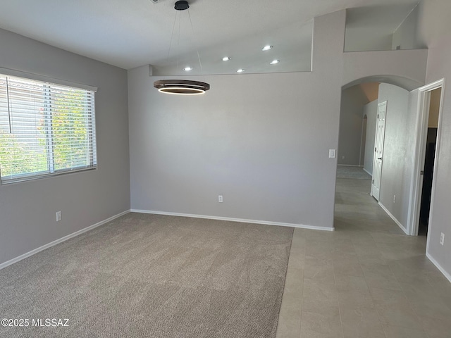 6960 W Harcuvar Dr, Tucson, AZ 85743 - empty room featuring arched walkways, recessed lighting, and baseboards