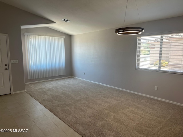 6960 W Harcuvar Dr, Tucson, AZ 85743 - spare room with lofted ceiling, light colored carpet, and baseboards