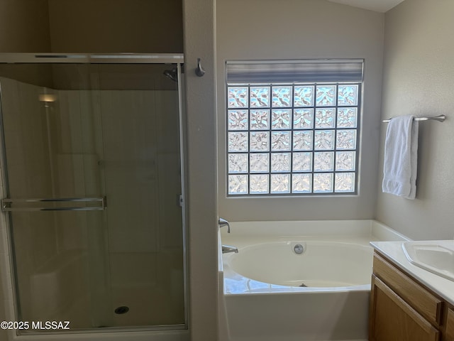 6960 W Harcuvar Dr, Tucson, AZ 85743 - full bathroom featuring vanity, a garden tub, and a shower stall