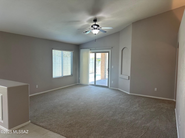 6960 W Harcuvar Dr, Tucson, AZ 85743 - carpeted empty room featuring ceiling fan, vaulted ceiling, and baseboards