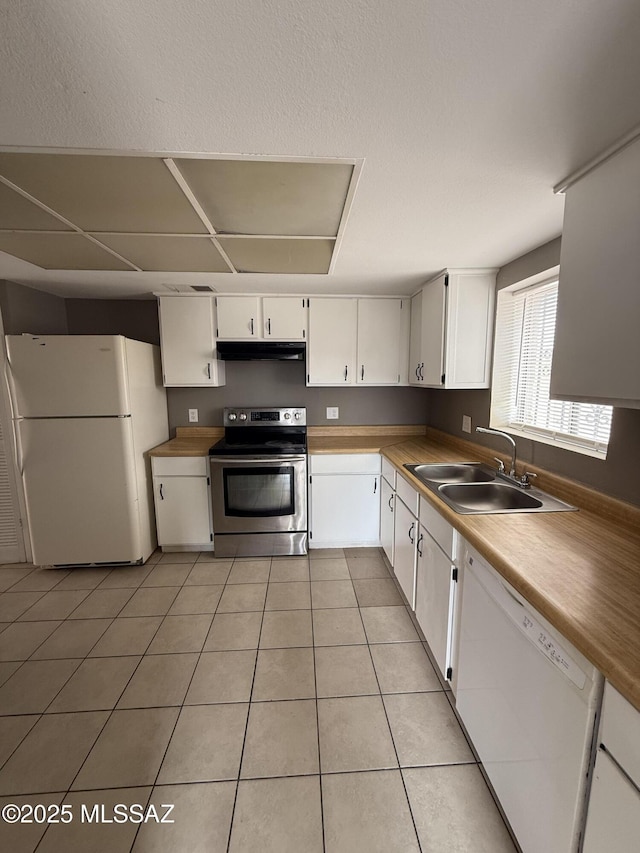 1036 W Michigan St, Tucson, AZ 85714 - kitchen featuring white appliances, a sink, under cabinet range hood, white cabinetry, and light tile patterned flooring