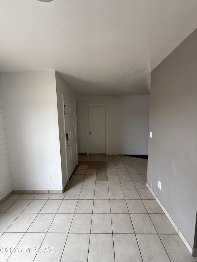 1036 W Michigan St, Tucson, AZ 85714 - spare room with light tile patterned floors and baseboards