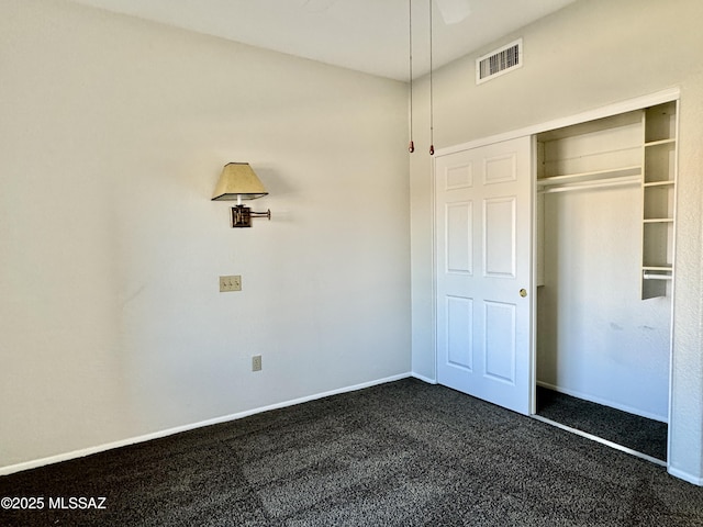 13942 N Cirrus Hill Dr, Oro Valley, AZ 85755 - unfurnished bedroom featuring dark colored carpet, baseboards, and a closet