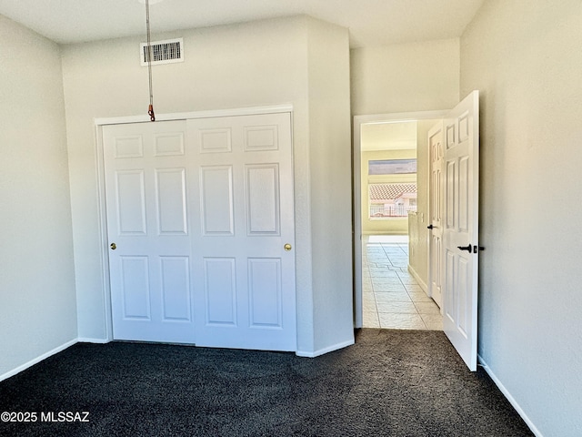 13942 N Cirrus Hill Dr, Oro Valley, AZ 85755 - unfurnished bedroom featuring carpet, baseboards, and a closet