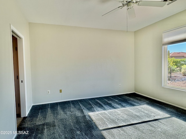 13942 N Cirrus Hill Dr, Oro Valley, AZ 85755 - spare room with dark carpet, a ceiling fan, and baseboards