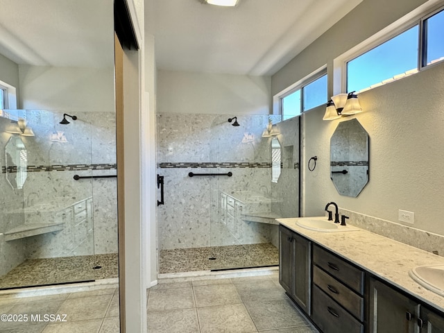 13942 N Cirrus Hill Dr, Oro Valley, AZ 85755 - bathroom featuring a tile shower, double vanity, and tile patterned flooring