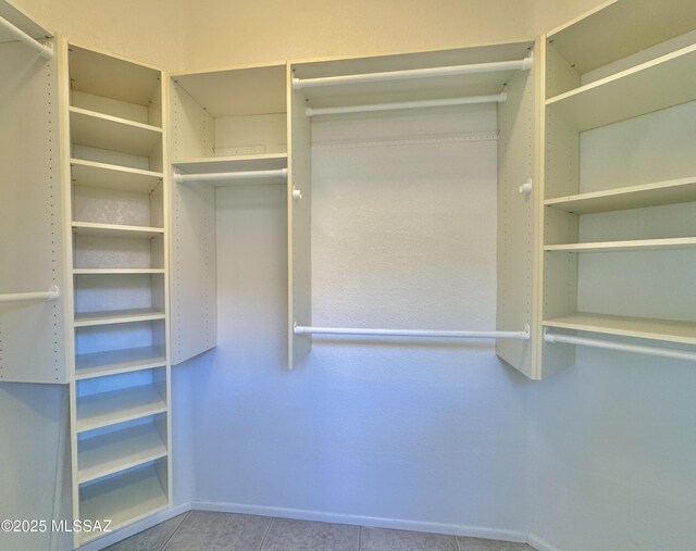 13942 N Cirrus Hill Dr, Oro Valley, AZ 85755 - walk in closet with tile patterned floors