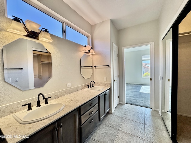 13942 N Cirrus Hill Dr, Oro Valley, AZ 85755 - bathroom featuring double vanity, tile patterned floors, and baseboards