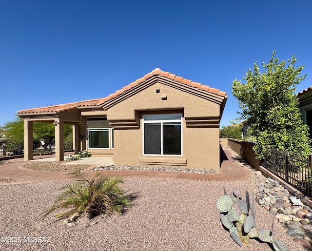 13942 N Cirrus Hill Dr, Oro Valley, AZ 85755 - back of property with stucco siding, a tile roof, and a patio area