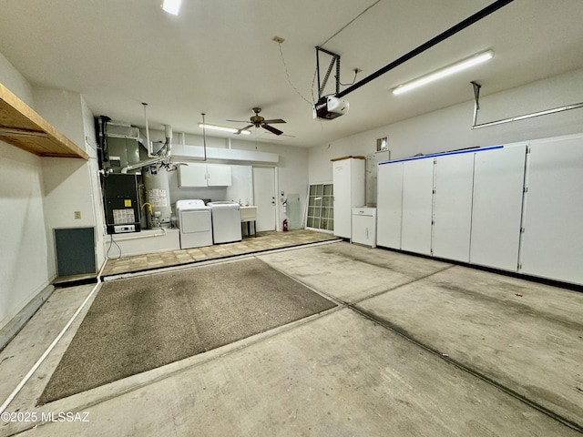 13942 N Cirrus Hill Dr, Oro Valley, AZ 85755 - garage with independent washer and dryer, a garage door opener, ceiling fan, gas water heater, and a sink