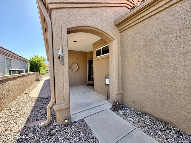 13942 N Cirrus Hill Dr, Oro Valley, AZ 85755 - property entrance with stucco siding and a patio area