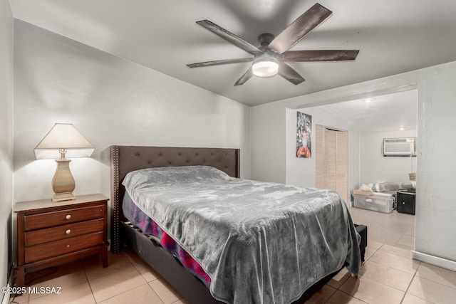 1341 E Bilby Rd, Tucson, AZ 85706 - bedroom featuring an AC wall unit, tile patterned flooring, ceiling fan, lofted ceiling, and a closet