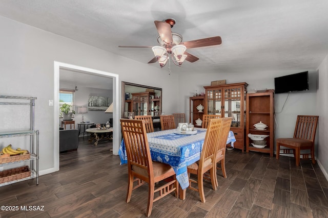 1341 E Bilby Rd, Tucson, AZ 85706 - dining area with a ceiling fan and dark wood-style floors