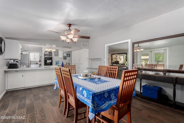 1341 E Bilby Rd, Tucson, AZ 85706 - dining room featuring a chandelier, ceiling fan, dark wood-style flooring, and a textured ceiling