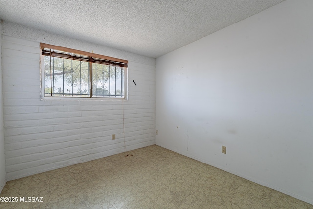 8401 E Shasta Dr, Tucson, AZ 85730 - spare room with a textured ceiling