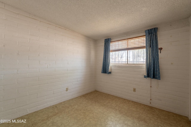 8401 E Shasta Dr, Tucson, AZ 85730 - empty room featuring tile patterned floors and a textured ceiling