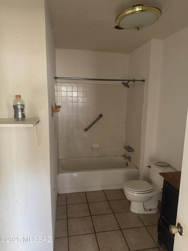 bathroom featuring toilet, vanity,  shower combination, and tile patterned flooring