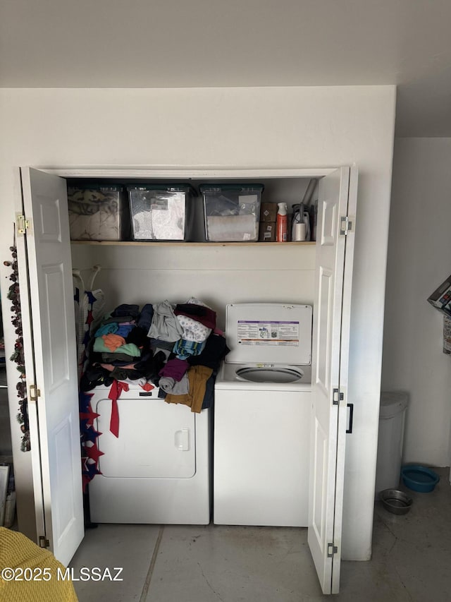 washroom with independent washer and dryer