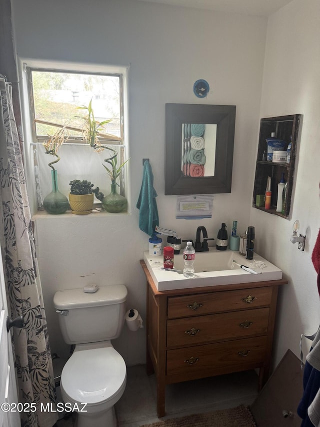 full bathroom with vanity and toilet