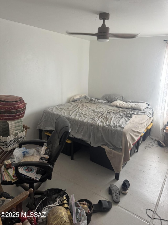 bedroom featuring concrete flooring and a ceiling fan