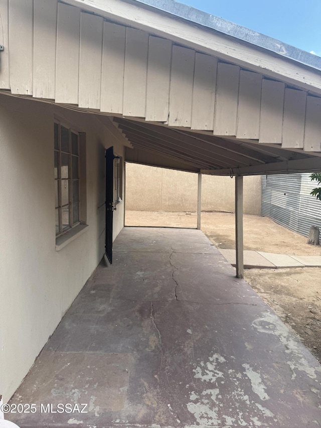 view of vehicle parking featuring a carport