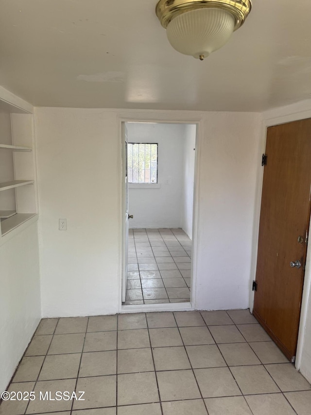 empty room with light tile patterned floors