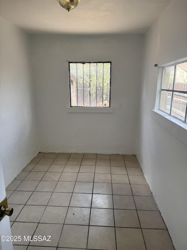 empty room featuring light tile patterned floors