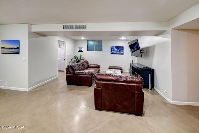 6631 N Camino Padre Isidoro, Tucson, AZ 85718 - living room with baseboards and finished concrete flooring