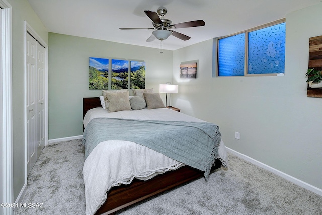 6631 N Camino Padre Isidoro, Tucson, AZ 85718 - bedroom with carpet floors, a closet, baseboards, and a ceiling fan