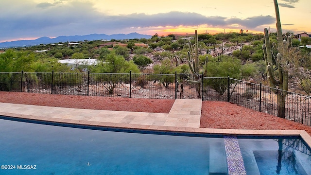 6631 N Camino Padre Isidoro, Tucson, AZ 85718 - view of swimming pool with a mountain view