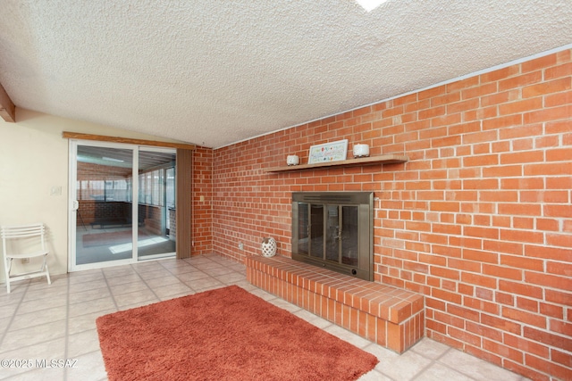 2702 E Prince Rd, Tucson, AZ 85716 - unfurnished living room featuring a textured ceiling, tile patterned flooring, a fireplace, lofted ceiling, and brick wall