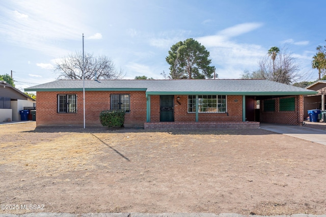 2702 E Prince Rd, Tucson, AZ 85716 - ranch-style home featuring brick siding, concrete driveway, and a carport