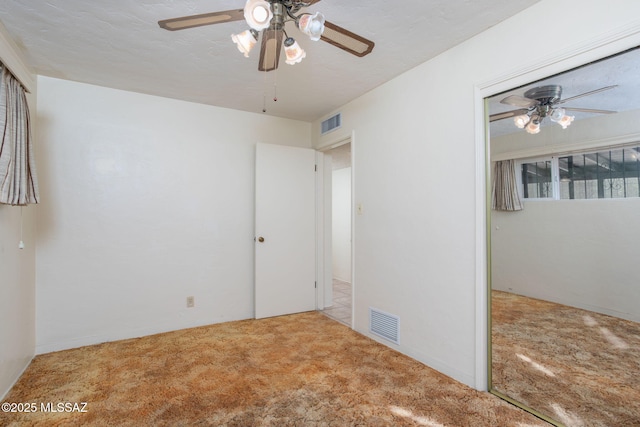 2702 E Prince Rd, Tucson, AZ 85716 - unfurnished bedroom featuring carpet flooring, a ceiling fan, and a closet