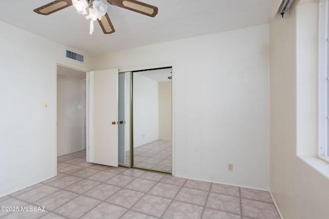 2702 E Prince Rd, Tucson, AZ 85716 - unfurnished bedroom featuring a closet and ceiling fan