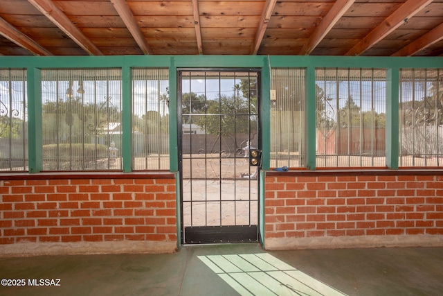 2702 E Prince Rd, Tucson, AZ 85716 - unfurnished sunroom featuring beamed ceiling