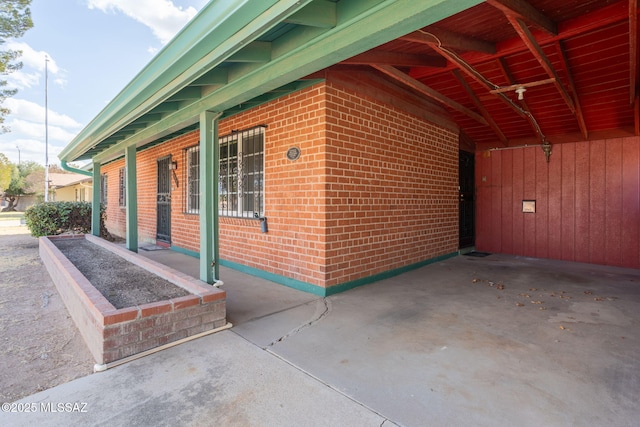 2702 E Prince Rd, Tucson, AZ 85716 - view of side of home featuring brick siding
