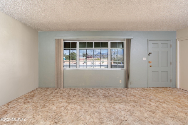 2702 E Prince Rd, Tucson, AZ 85716 - unfurnished room featuring carpet flooring and a textured ceiling