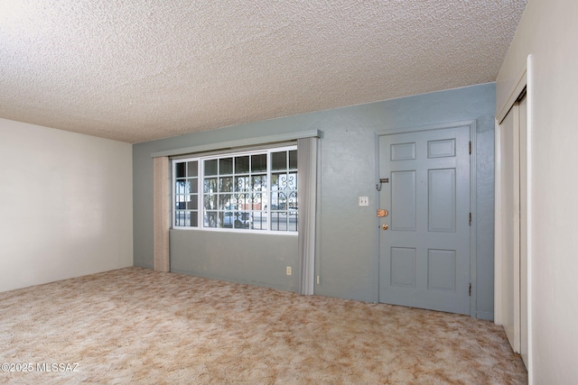 2702 E Prince Rd, Tucson, AZ 85716 - carpeted entryway with a textured ceiling